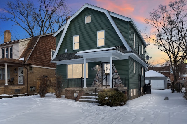 14810 Mettetal St, Detroit, MI 48227 - dutch colonial featuring covered porch, an outdoor structure, a gambrel roof, and a garage