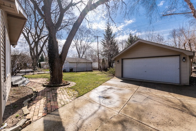 detached garage featuring fence