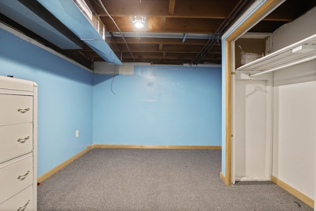 unfinished basement with baseboards and carpet floors