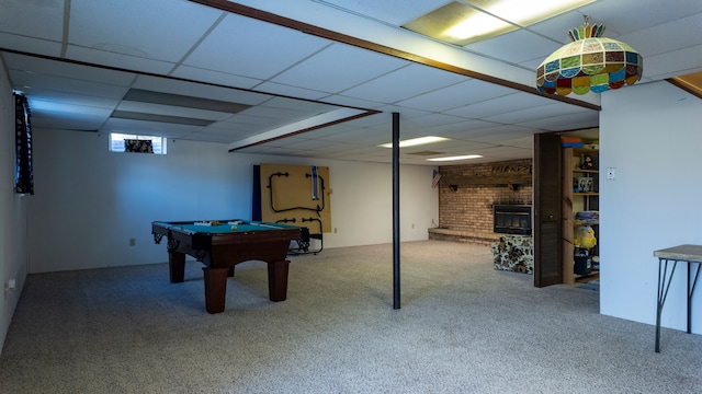 game room with billiards, carpet flooring, a fireplace, and a drop ceiling