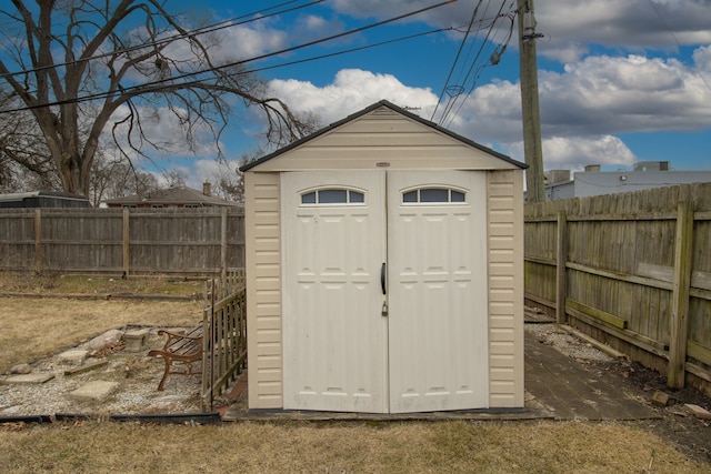 view of shed featuring a fenced backyard