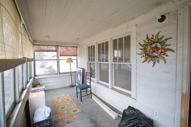 sunroom / solarium featuring wood ceiling