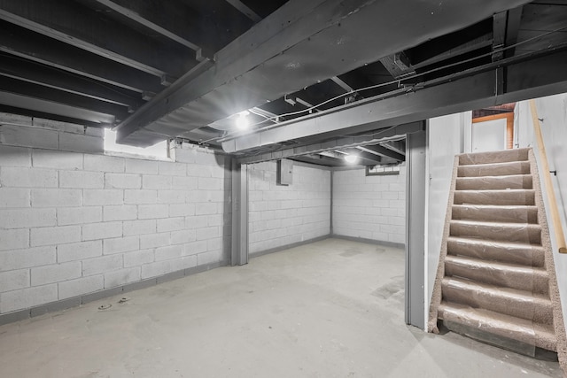 unfinished basement with electric panel and stairs