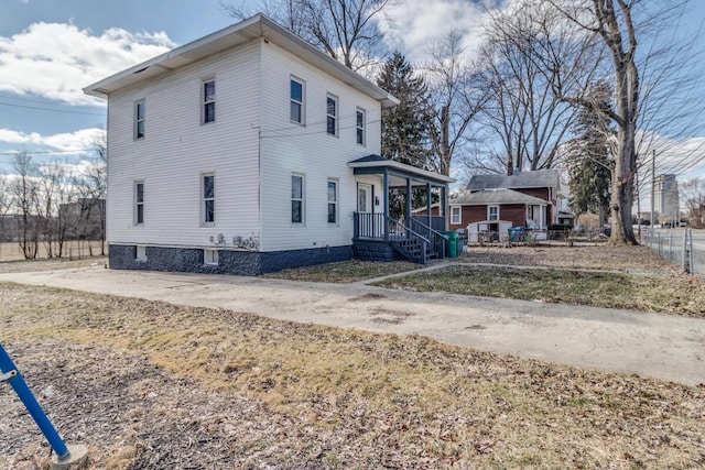 view of side of home with fence