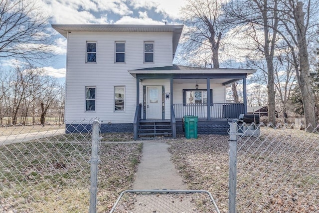 view of front of home featuring covered porch and fence