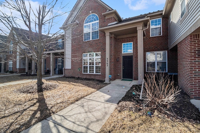 view of front of home featuring brick siding