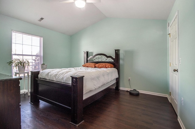 bedroom featuring lofted ceiling, wood finished floors, visible vents, a ceiling fan, and baseboards