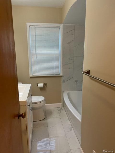 full bathroom featuring marble finish floor, vanity, toilet, and baseboards