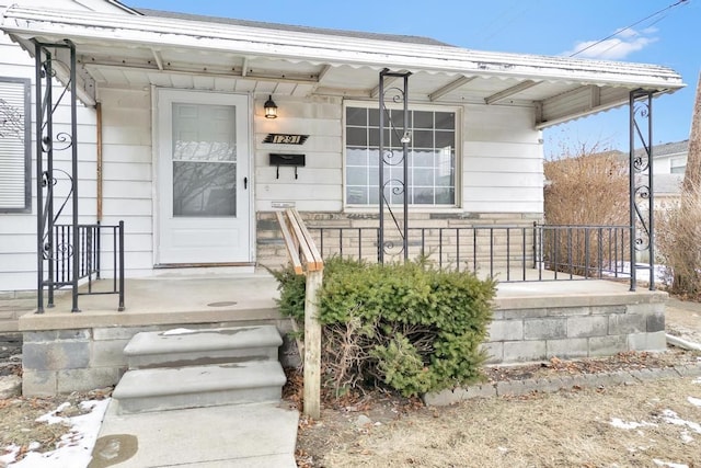 doorway to property featuring a porch