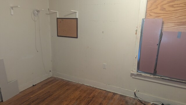 empty room with wood finished floors