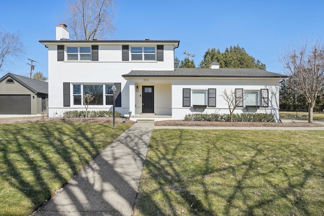 traditional-style home featuring a front yard and a chimney