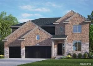 view of front of house with a garage, driveway, and a front yard