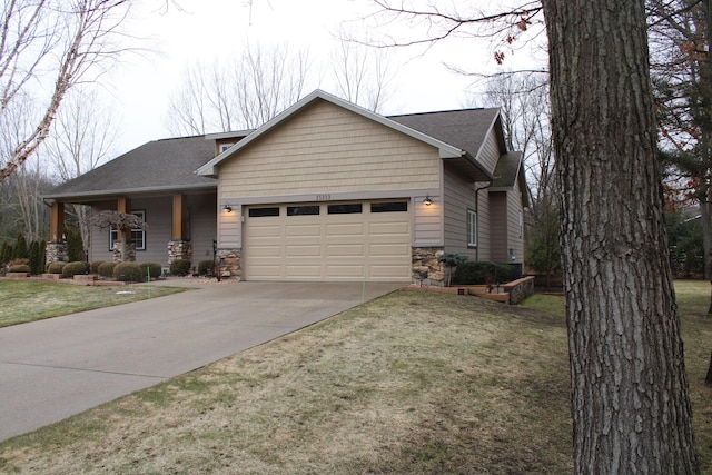 view of front facade featuring roof with shingles, concrete driveway, an attached garage, stone siding, and a front lawn