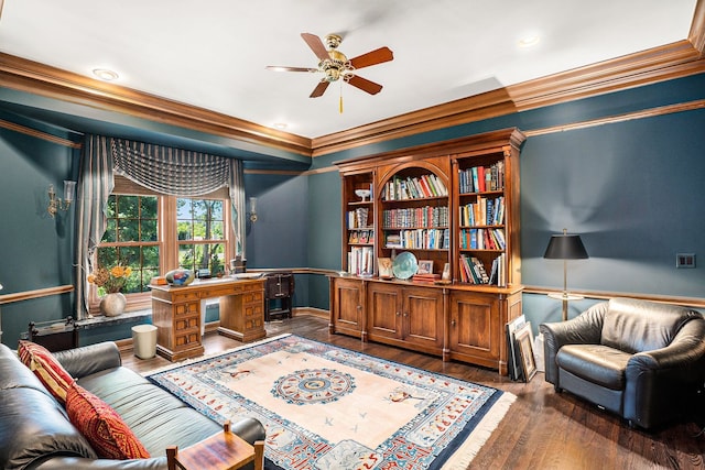 office featuring ceiling fan, baseboards, wood finished floors, and crown molding