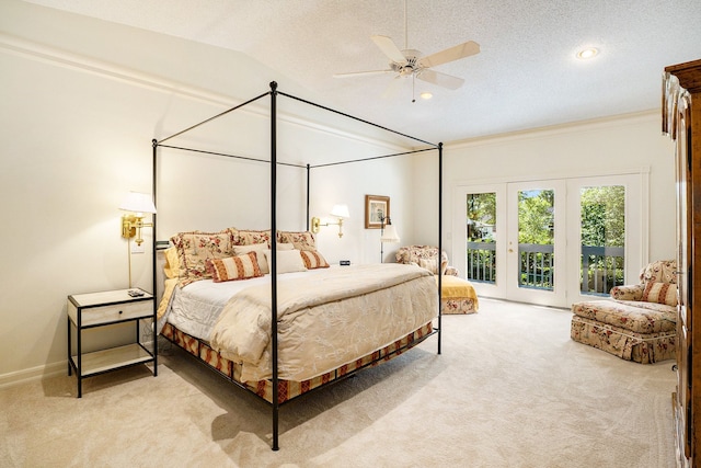 bedroom with a textured ceiling, light carpet, vaulted ceiling, access to outside, and ornamental molding