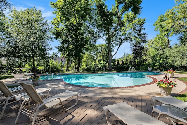 outdoor pool with a deck