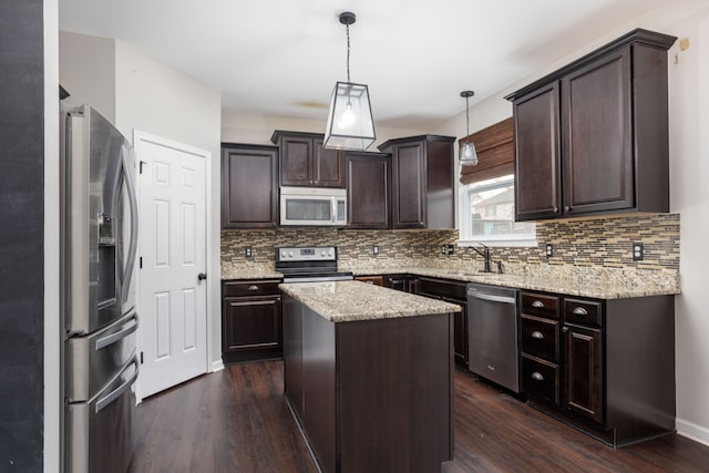 kitchen with decorative backsplash, dark brown cabinetry, dark wood-style floors, and appliances with stainless steel finishes