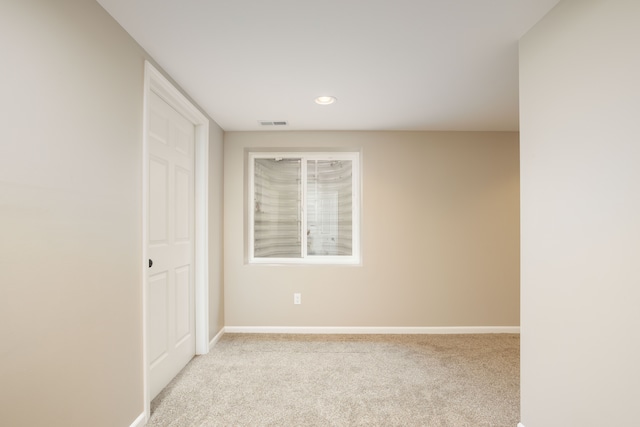 spare room with recessed lighting, baseboards, carpet floors, and visible vents