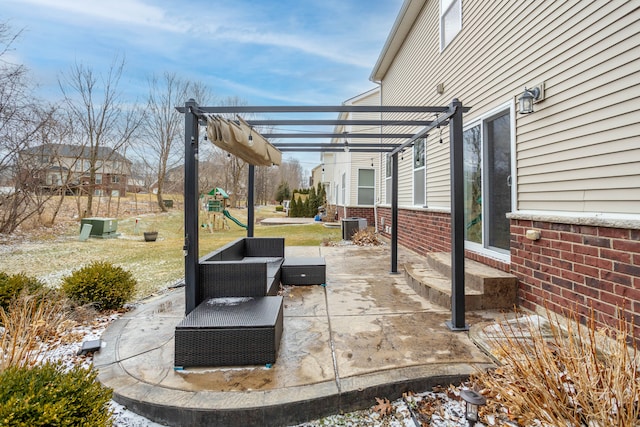 view of patio featuring a playground and a pergola