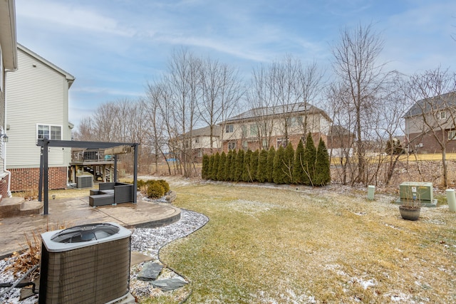 view of yard with cooling unit and a patio area