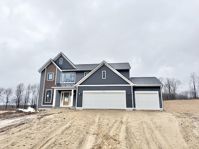 view of front of property with a garage, a shingled roof, and dirt driveway