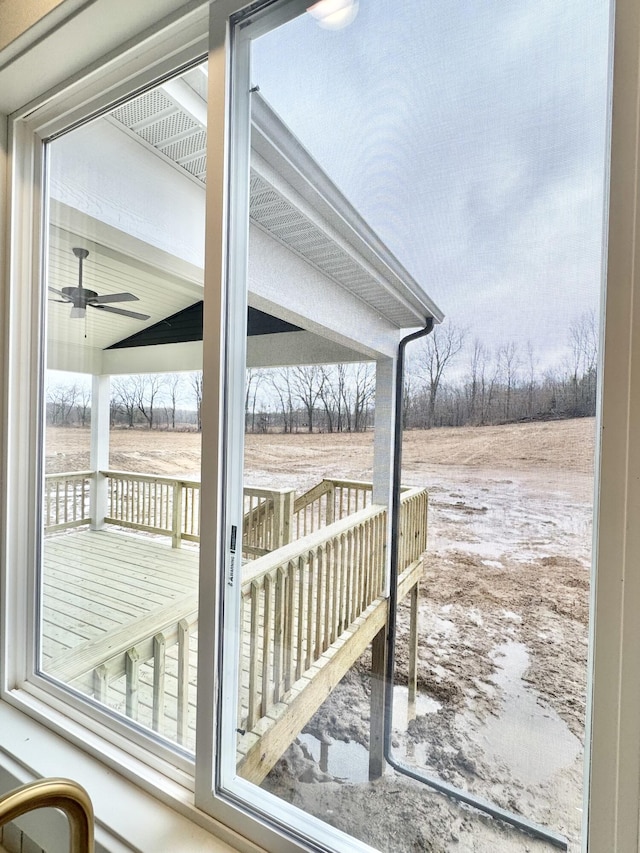 doorway to outside with a ceiling fan