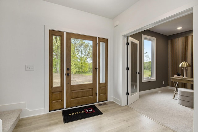 7711 96th St SE, Alto, MI 49302 - entrance foyer with light wood finished floors and baseboards