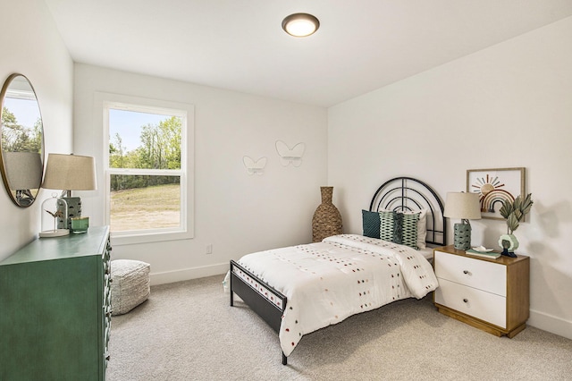 7711 96th St SE, Alto, MI 49302 - bedroom with baseboards and light colored carpet