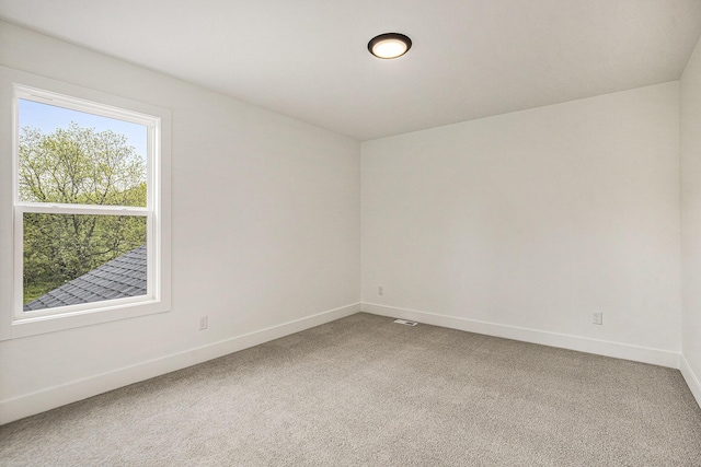7711 96th St SE, Alto, MI 49302 - empty room with light colored carpet and baseboards