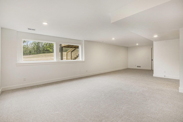7711 96th St SE, Alto, MI 49302 - unfurnished room featuring light colored carpet, recessed lighting, and baseboards