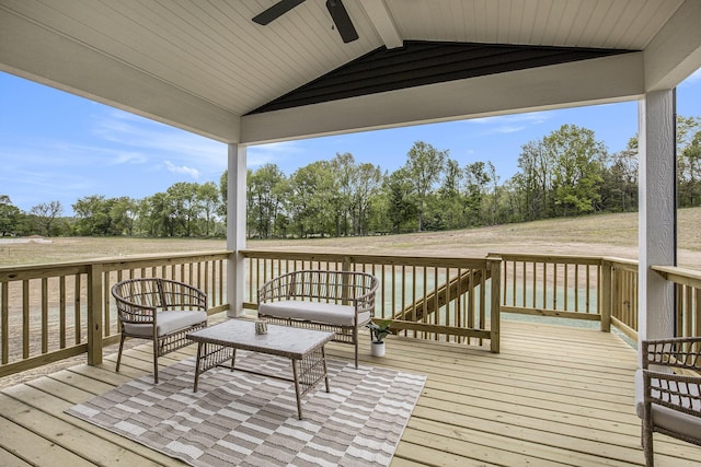 7711 96th St SE, Alto, MI 49302 - wooden terrace with ceiling fan, an outdoor hangout area, and view of wooded area