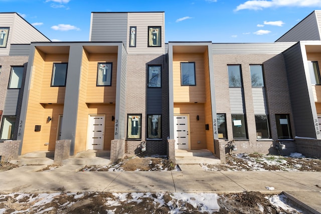 view of front of home featuring brick siding