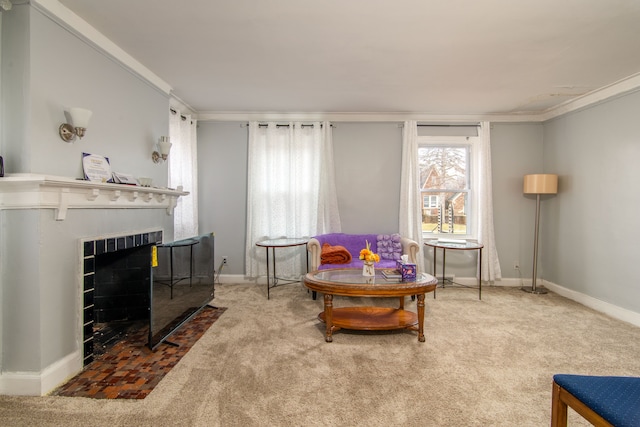 living area featuring carpet floors, a fireplace, crown molding, and baseboards