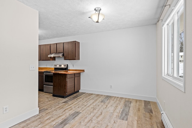 kitchen with electric stove, baseboard heating, a wealth of natural light, and under cabinet range hood