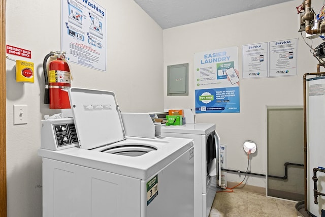 common laundry area featuring washer and dryer and light tile patterned flooring