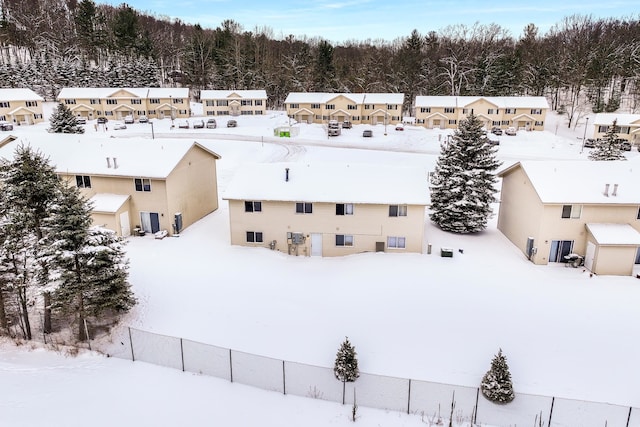 snowy aerial view featuring a residential view