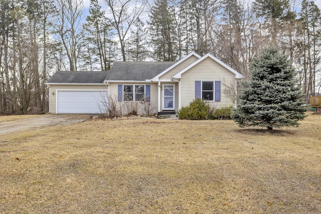 ranch-style home featuring a garage, driveway, and a front lawn