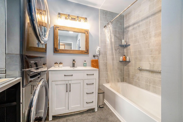 full bathroom with washer / clothes dryer, shower / bath combo with shower curtain, and vanity