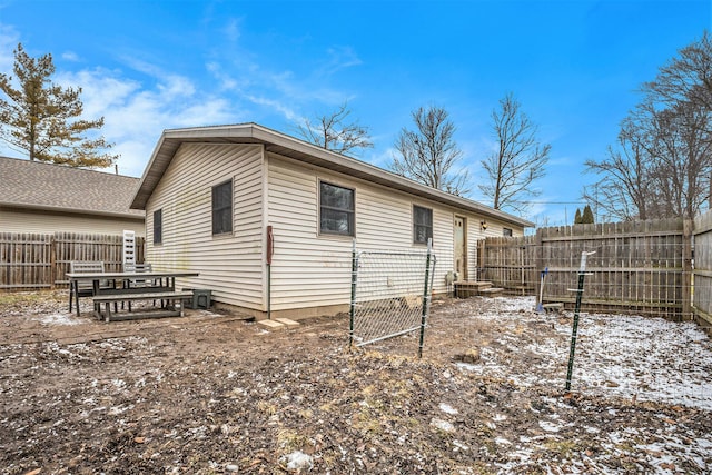 view of side of property with a fenced backyard