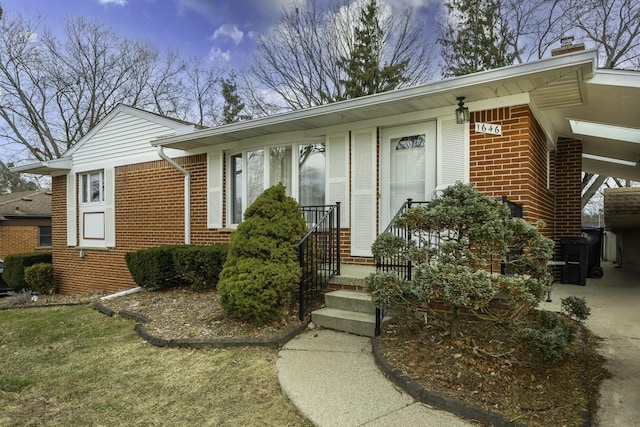 view of front of house featuring brick siding