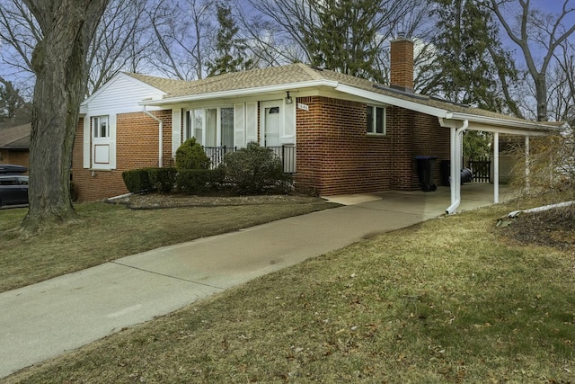 view of front facade featuring brick siding, a chimney, and a front lawn