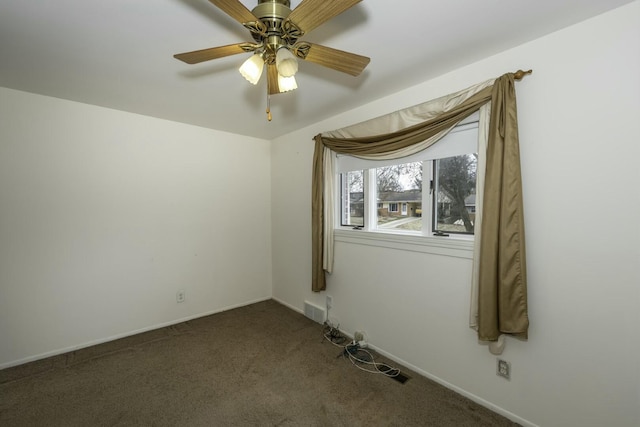 empty room featuring carpet, visible vents, ceiling fan, and baseboards