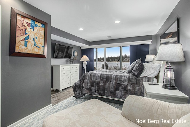 bedroom featuring recessed lighting, baseboards, and wood finished floors