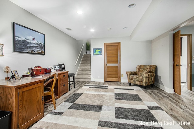 office space featuring recessed lighting, visible vents, light wood-style flooring, and baseboards