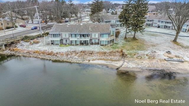bird's eye view with a water view and a residential view