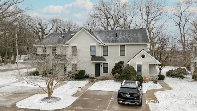 view of front of property featuring a shingled roof