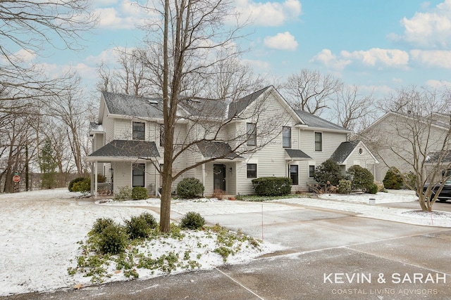 view of front of home featuring roof with shingles