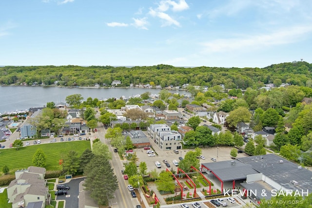 bird's eye view featuring a water view and a forest view