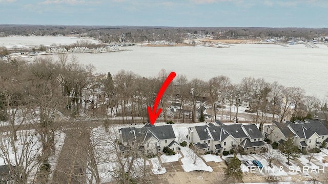 drone / aerial view featuring a residential view and a water view