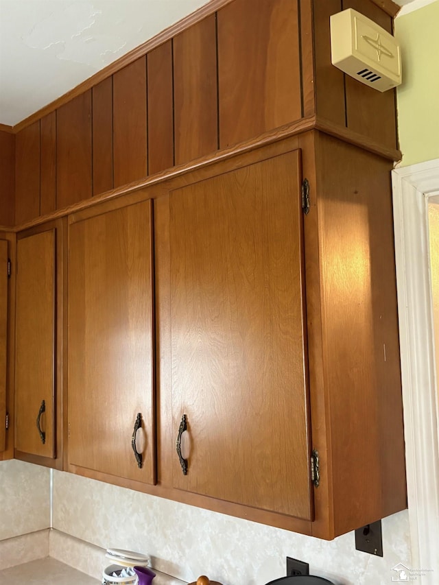 interior details featuring brown cabinetry